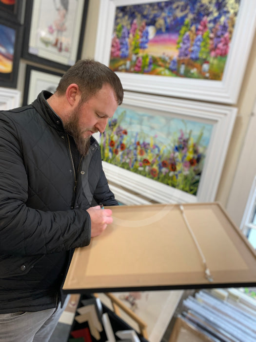 Artist Shaun Tymon signing A Total Shambles original